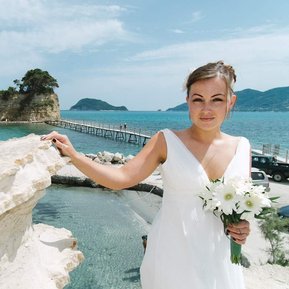 Bride poses at the bridge before her wedding at cameo Island, Zante.