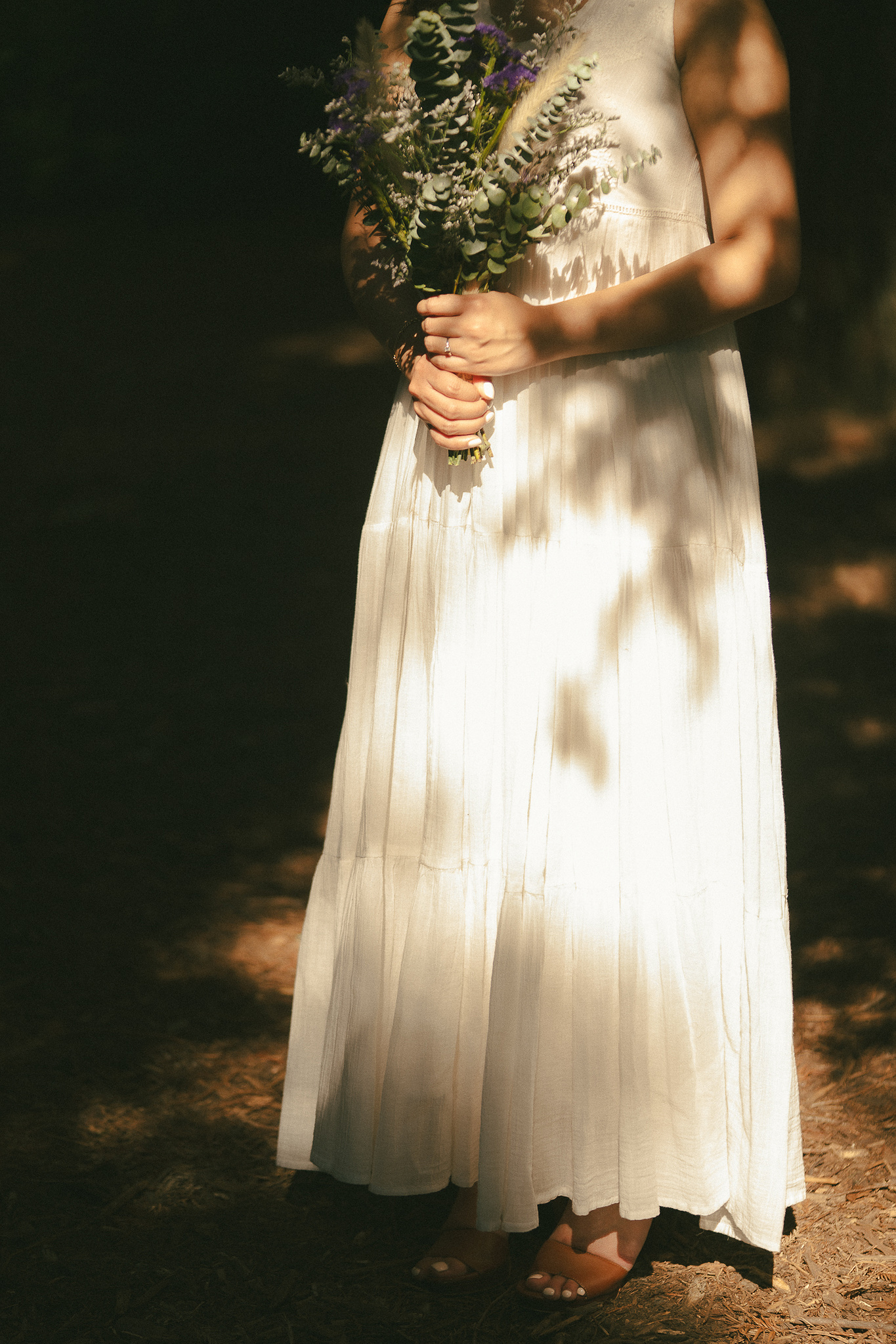 The bride poses in sun and shadows for a warm, organic portrait. An intimate, romantic elopement in the Redwoods Grove in Orange County, CA. Aly Rose Photo, wedding, elopement, engagement, portrait photographer in Southern California.