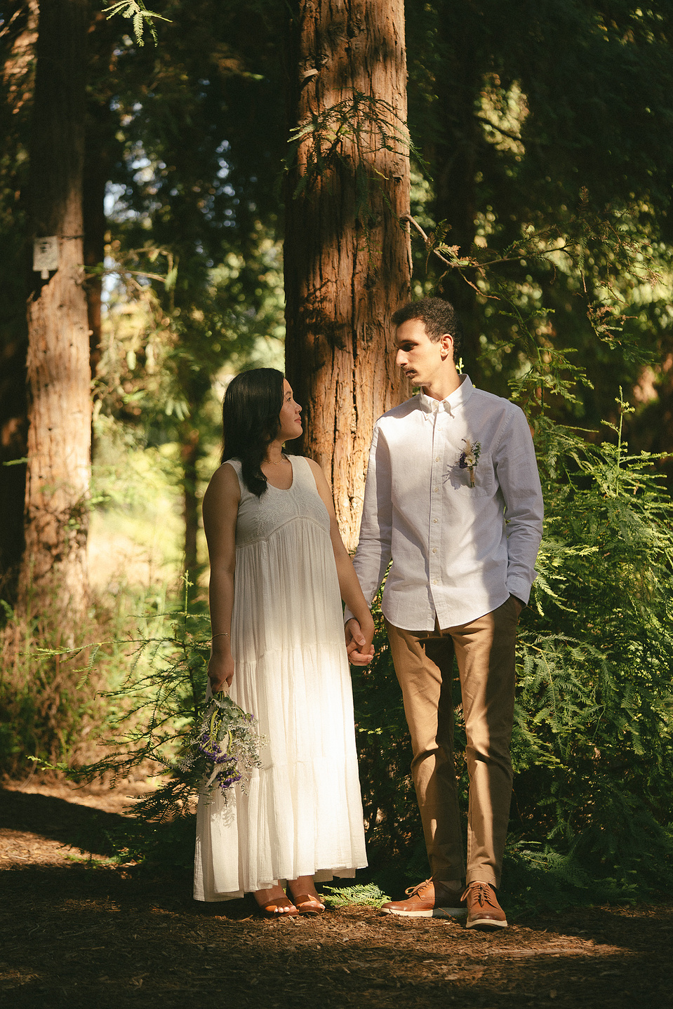 The bride and groom pose holding hands, staring into each other's eyes for a portrait.An intimate, romantic elopement in the Redwoods Grove in Orange County, CA. Aly Rose Photo, wedding, elopement, engagement, portrait photographer in Southern California.