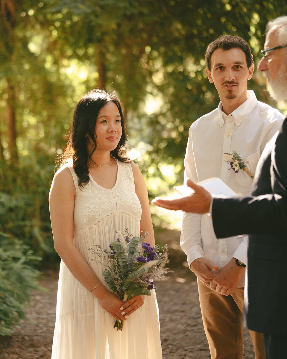 The bride and groom listen to the officiant as the ceremony begins. An intimate, romantic elopement in the Redwoods Grove in Orange County, CA. Aly Rose Photo, wedding, elopement, engagement, portrait photographer in Southern California.