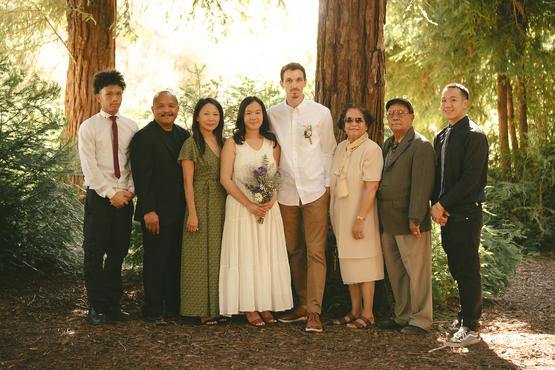 The bride and groom pose with family for a warm, organic portrait. An intimate, romantic elopement in the Redwoods Grove in Orange County, CA. Aly Rose Photo, wedding, elopement, engagement, portrait photographer in Southern California.