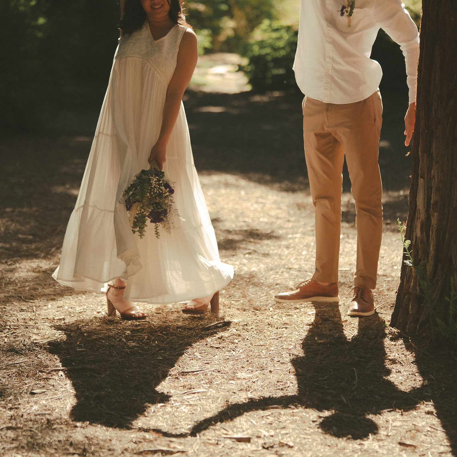 The bride and groom pose in a twirl for a warm, organic portrait. An intimate, romantic elopement in the Redwoods Grove in Orange County, CA. Aly Rose Photo, wedding, elopement, engagement, portrait photographer in Southern California.