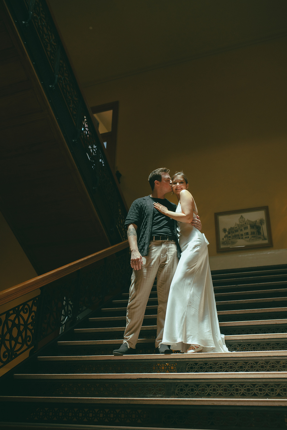 Bride and groom take portraits on the grand central staircase at their courthouse wedding ceremony, Old Orange County Courthouse, Santa Ana, CA, Aly Rose Photo, natural light engagement, elopement, wedding, portrait, lifestyle photographer SoCal