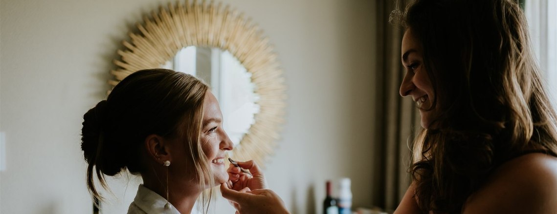 Bride getting final touches done before photos. Fairmont Whistler. Photography: Emily Serrel