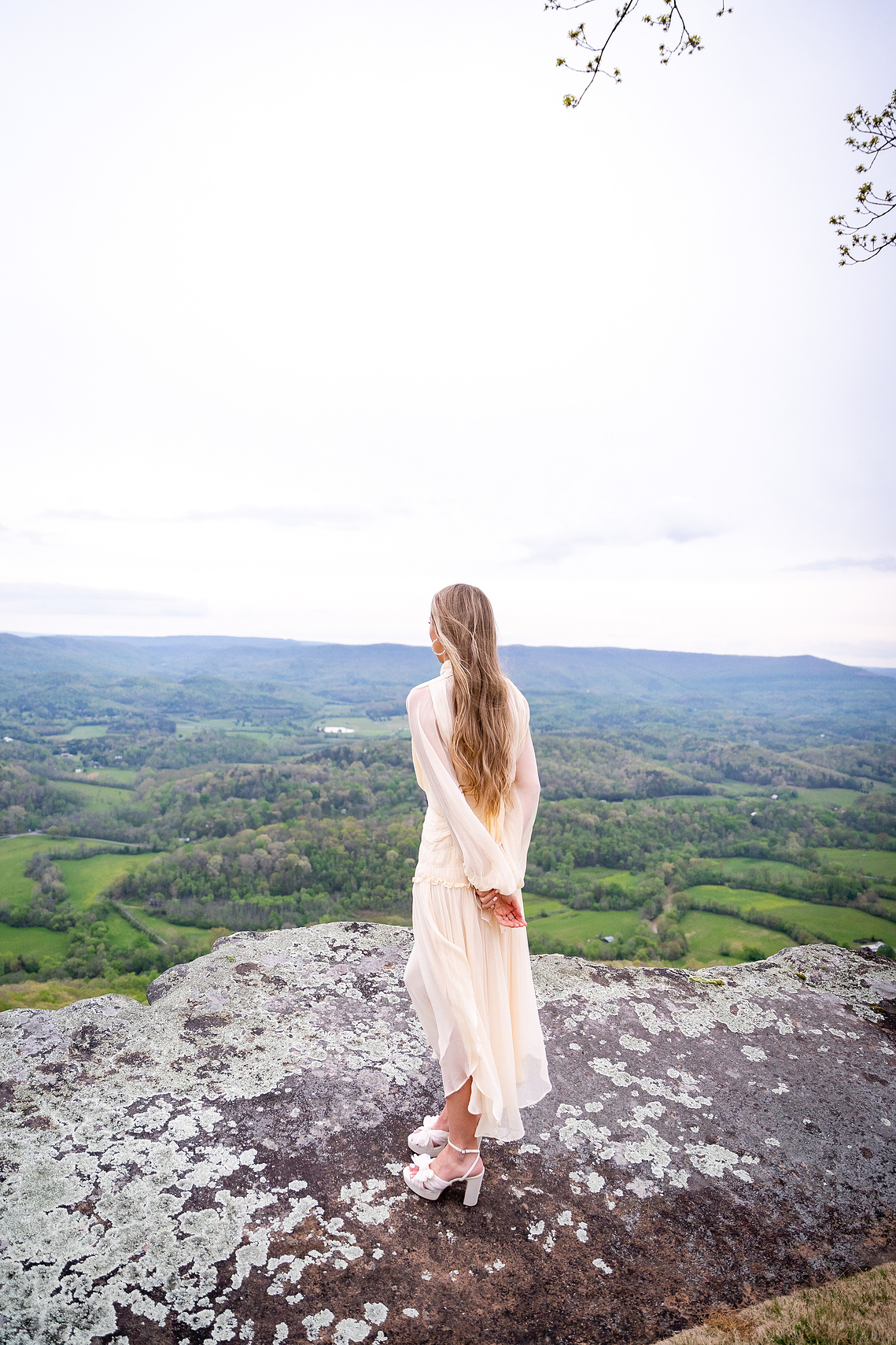 Female mountain staring out portrait photography
