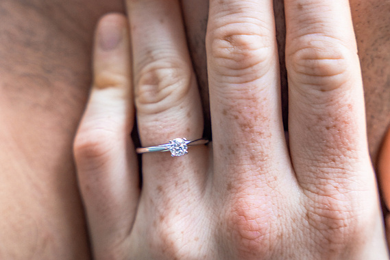 Engagement photos at Cloudland Canyon waterfall featuring romantic dancing poses and natural rock formations.
