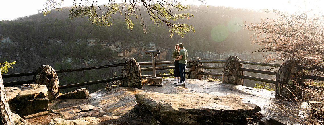 Surprise proposal at Cloudland Canyon State Park with sweeping valley views and golden morning light.