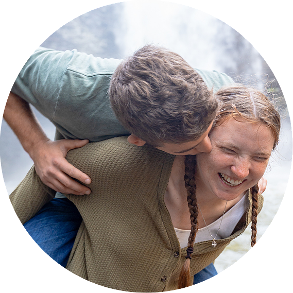 Engagement photos at Cloudland Canyon waterfall featuring romantic dancing poses and natural rock formations.