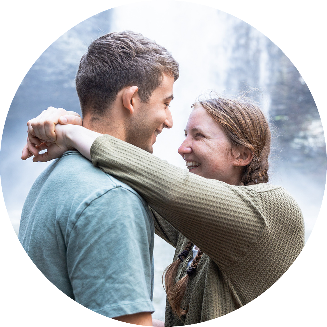Engagement photos at Cloudland Canyon waterfall featuring romantic dancing poses and natural rock formations.

