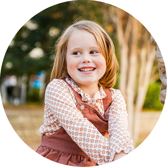 Kids playing near the Coolidge Park fountain, capturing joyful moments during a family photo session. Chattanooga family photographer
