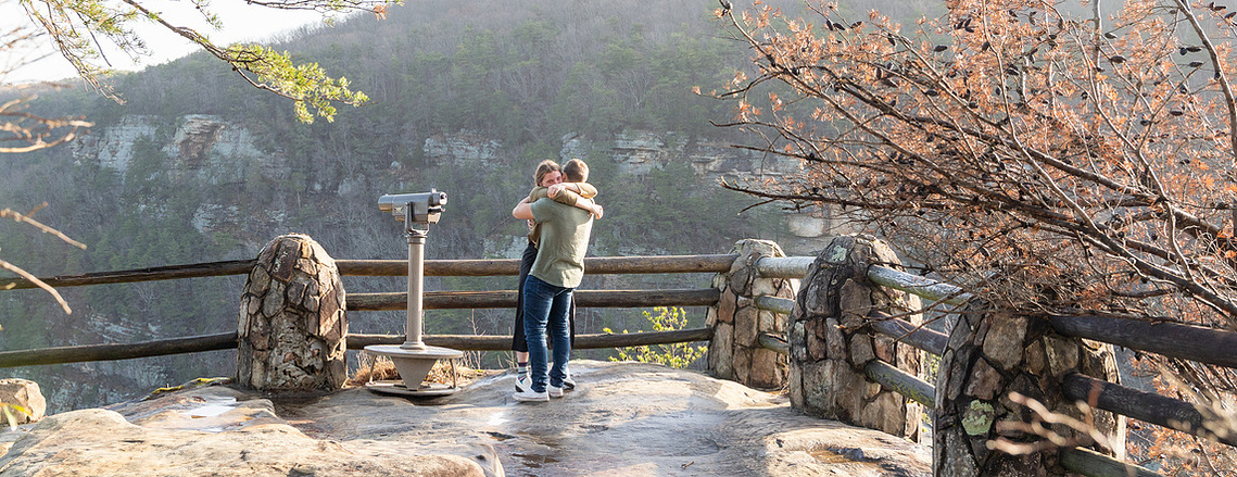 Surprise proposal at Cloudland Canyon State Park with sweeping valley views and golden morning light.

