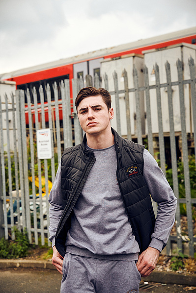 portrait-guy-train-railings-paul-shark-photography-by-matthew-stansfield
