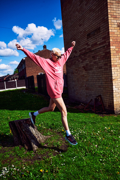 girl-pink-umbro-jumper-dress-girl-jumping-shot-by-matthew-stansfield