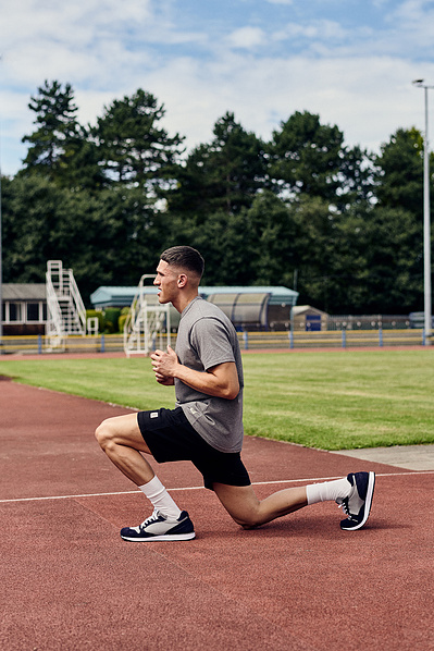 guy-stretching-race-track-shot-by-matthew-stansfield