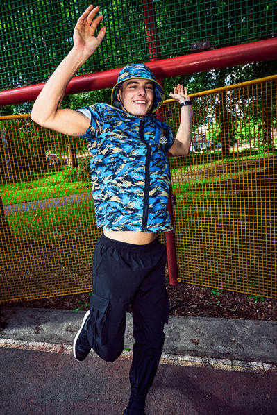 happy-guy-jumping-park-bucket-hat-shot-by-matthew-stansfield