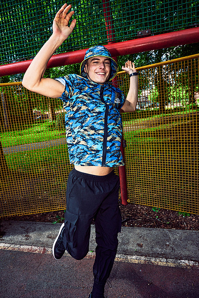 happy-guy-jumping-park-bucket-hat-shot-by-matthew-stansfield