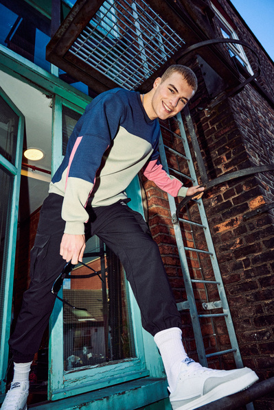 lad-smiling-fire-escape-steps-shot-by-matthew-stansfield
