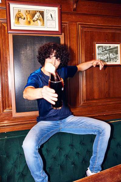 lad-throwing-pint-guiness-shot-by-matthew-stansfield