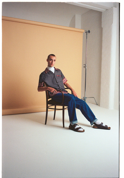 guy-shaved-head-sat-birkenstocks-shot-by-matthew-stansfield