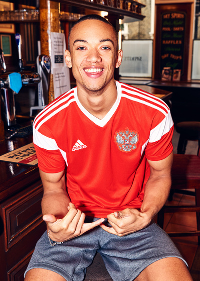 lad-wearing-football-shirt-sat-bar-shot-by-matthew-stansfield