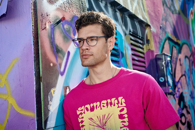 guy-wearing-glasses-graffiti-wall-shot-by-matthew-stansfield