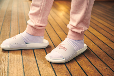 pair-white-lacoste-sliders-shot-by-matthew-stansfield