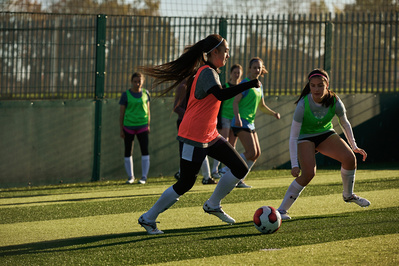 under-armour-girl-dribble-ball-football-pitch-photo-by-matthew-stansfield