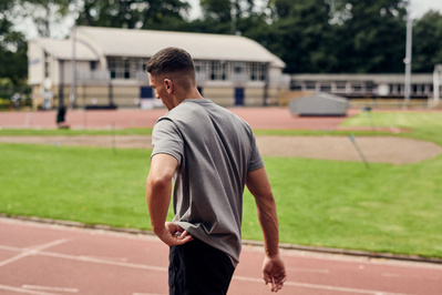 guy-walking-racetrack-away-shot-by-matthew-stansfield