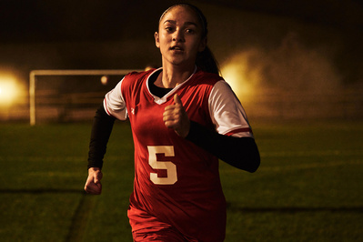 under-armour-girl-player-football-running-night-photo-by-matthew-stansfield