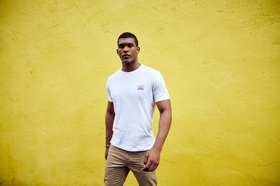 portrait-guy-yellow-wall-paul-shark-photography-by-matthew-stansfield