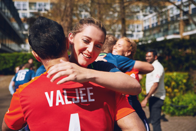 female-crickerer-hugging-player-shot-by-matthew-stansfield