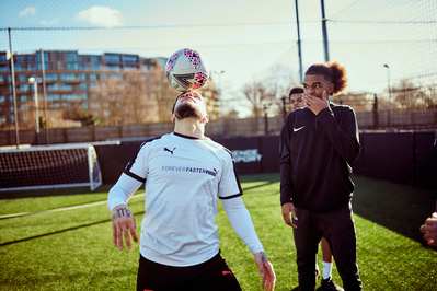 guy-balancing-football-head-shot-by-matthew-stansfield