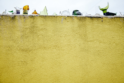 yellow-wall-glass-bottles-paul-shark-photography-by-matthew-stansfield