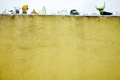 yellow-wall-glass-bottles-paul-shark-photography-by-matthew-stansfield