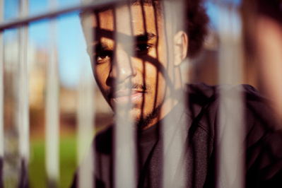 guy-looking-through-fence-shot-by-matthew-stansfield