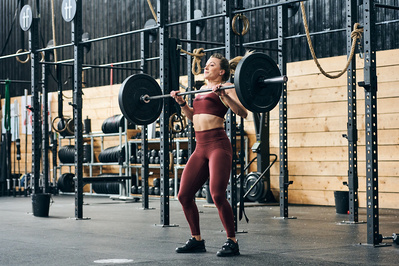 girl-athlete-gym-lifting-dumbbell-shot-by-matthew-stansfield