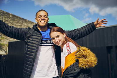 smiling-couple-arms-wide-shot-by-matthew-stansfield