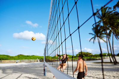 girl-jumping-smash-volleyball-bikini-beach-shot-by-matthew-stansfield