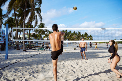 mates-playing-game-volleyball-beach-shot-by-matthew-stansfield