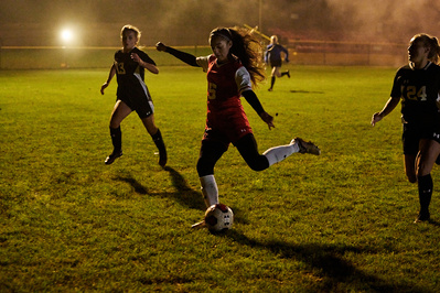 under-armour-girl-kicking-football-pitch-night-game-photo-by-matthew-stansfield