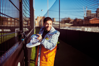 guy-laughing-holding-football-shot-by-matthew-stansfield