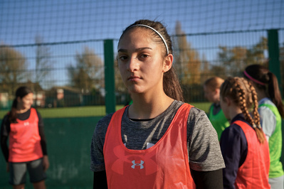 under-armour-girl-focused-football-pitch-photo-by-matthew-stansfield