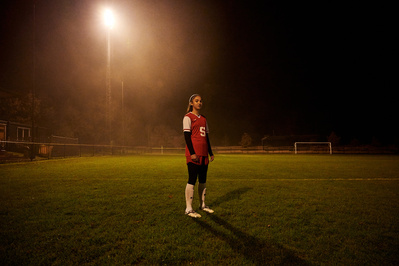 under-armour-girl-floodlight-night-football-pitch-photo-by-matthew-stansfield