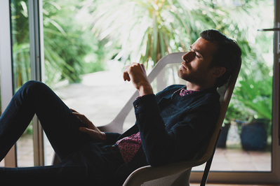 man-relaxing-chair-retro-shot-by-matthew-stansfield
