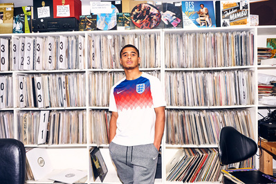 lad-wearing-football-shirt-record-shop-shot-by-matthew-stansfield