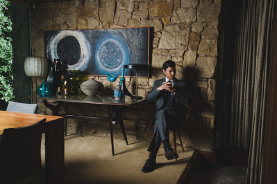 man-thinking-sitting-suit-chair-retro-shot-by-matthew-stansfield