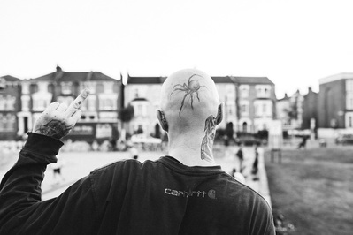guy-finger-up-spider-tattoo-shot-by-matthew-stansfield