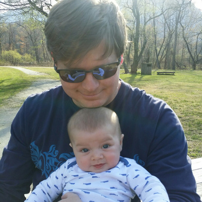 father holding son Uniquely Created Photography wedding photographer based in Columbus, Ohio. 