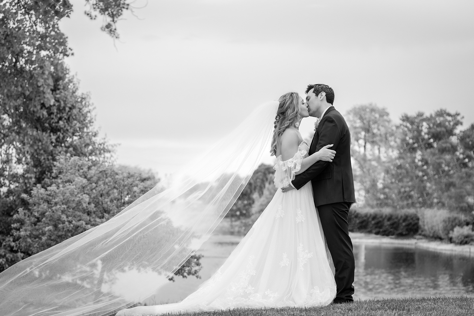 bride groom kissing after wedding 