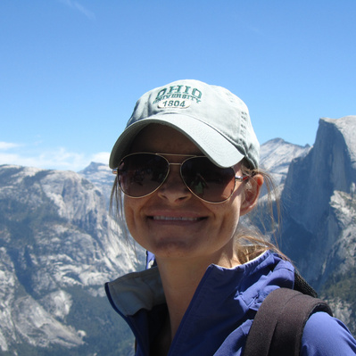 standing in front of the half dome Uniquely Created Photography wedding photographer based in Columbus, Ohio. 